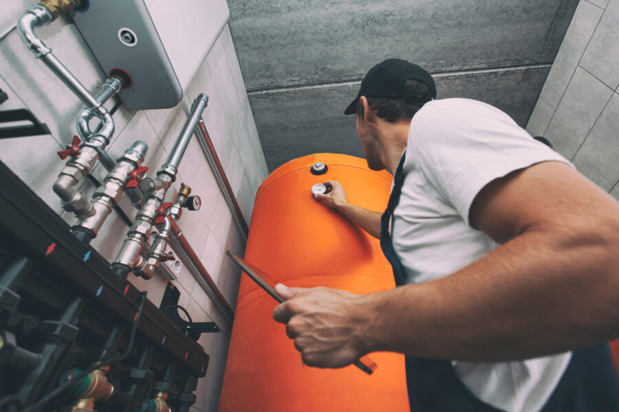 The,Technician,Checking,The,Heating,System,In,The,Boiler,Room